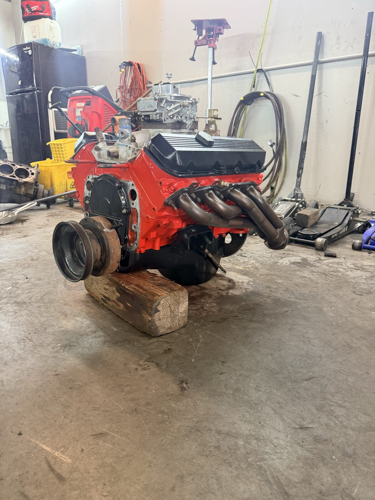 Rebuilt engine, painted orange, installed and running